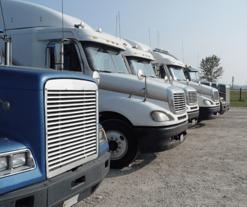 Image of semi trucks parked in a row