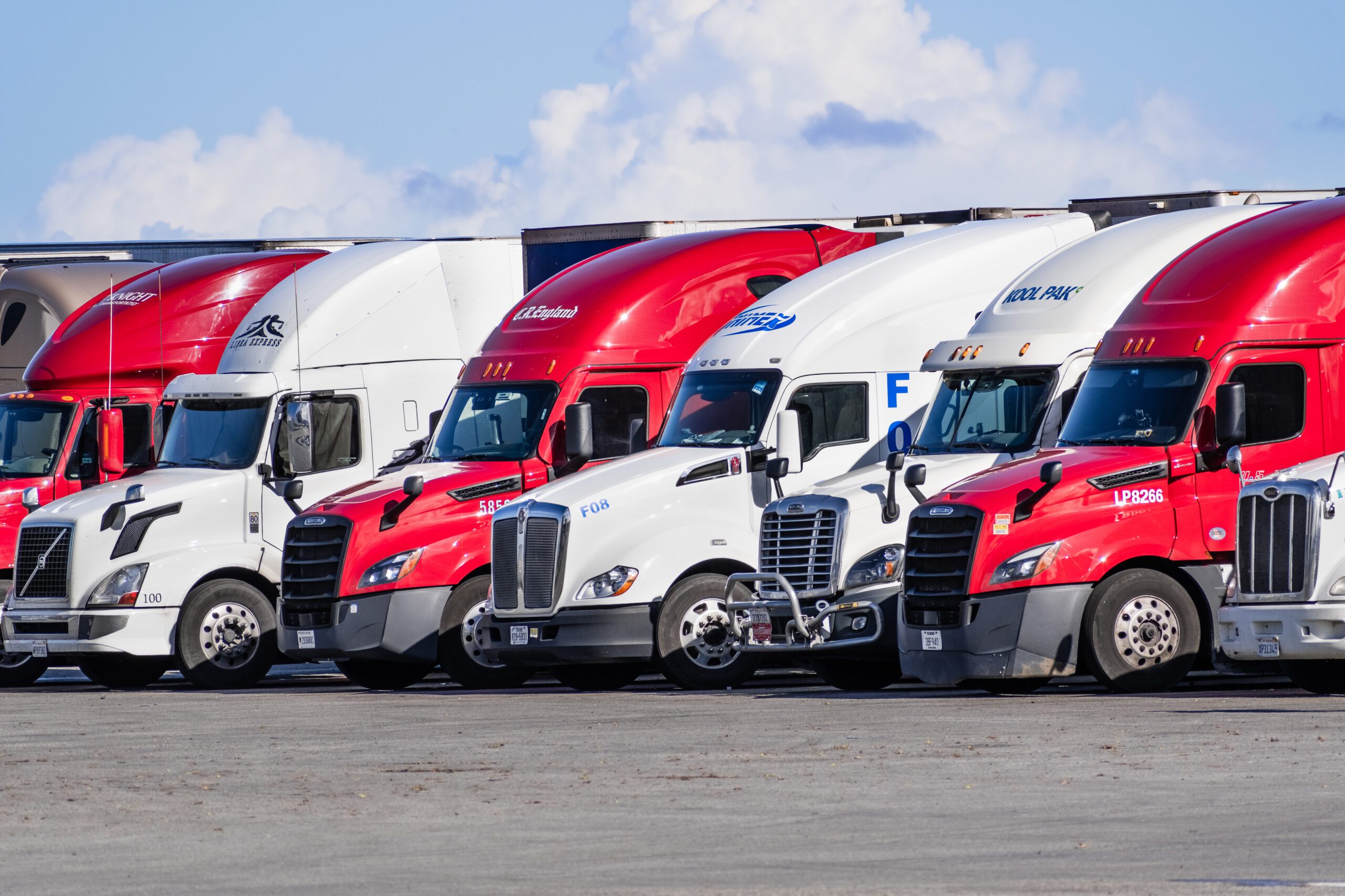a fleet of commercial trucks in line for alignment